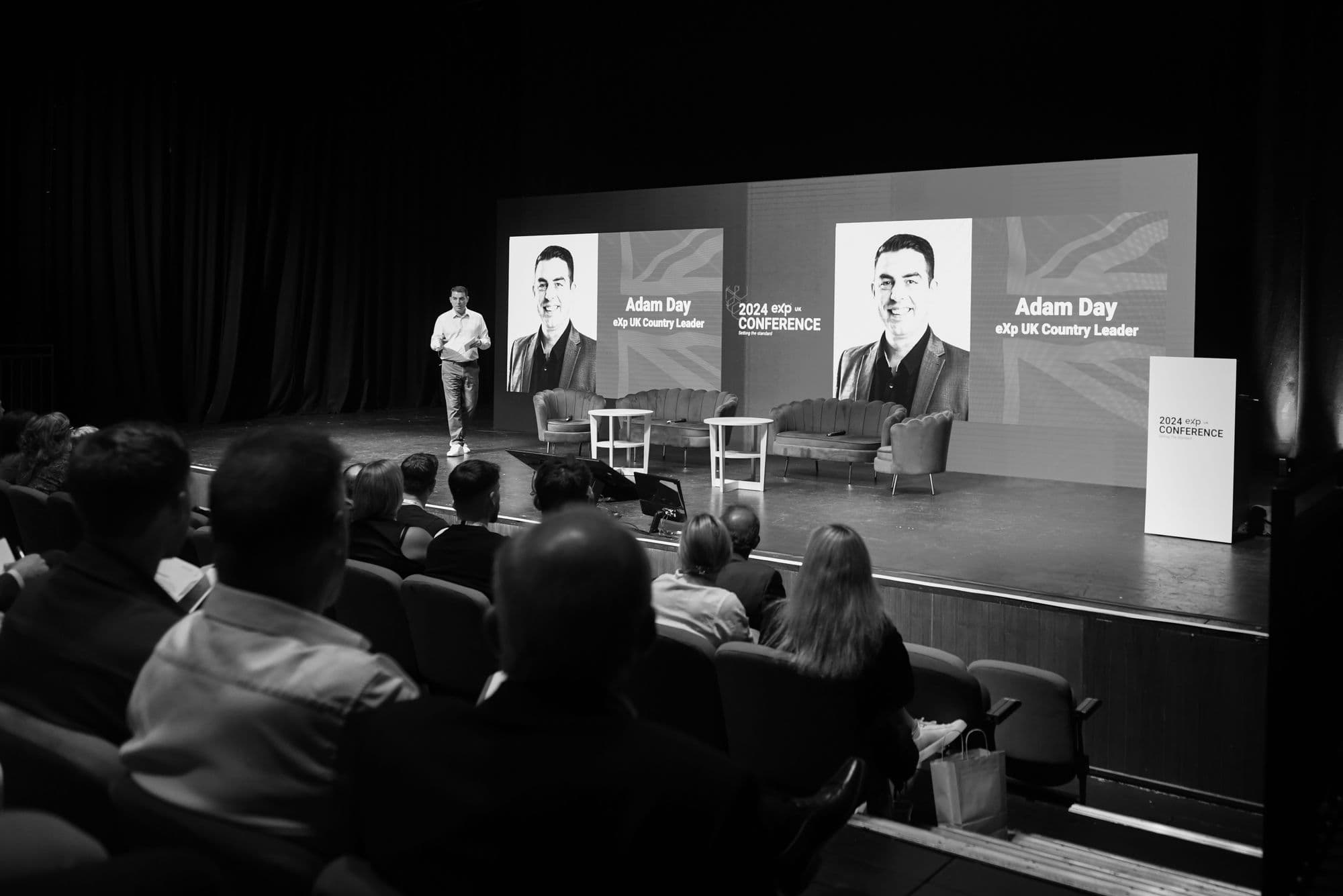 Adam Day on stage at eXp UK Conference