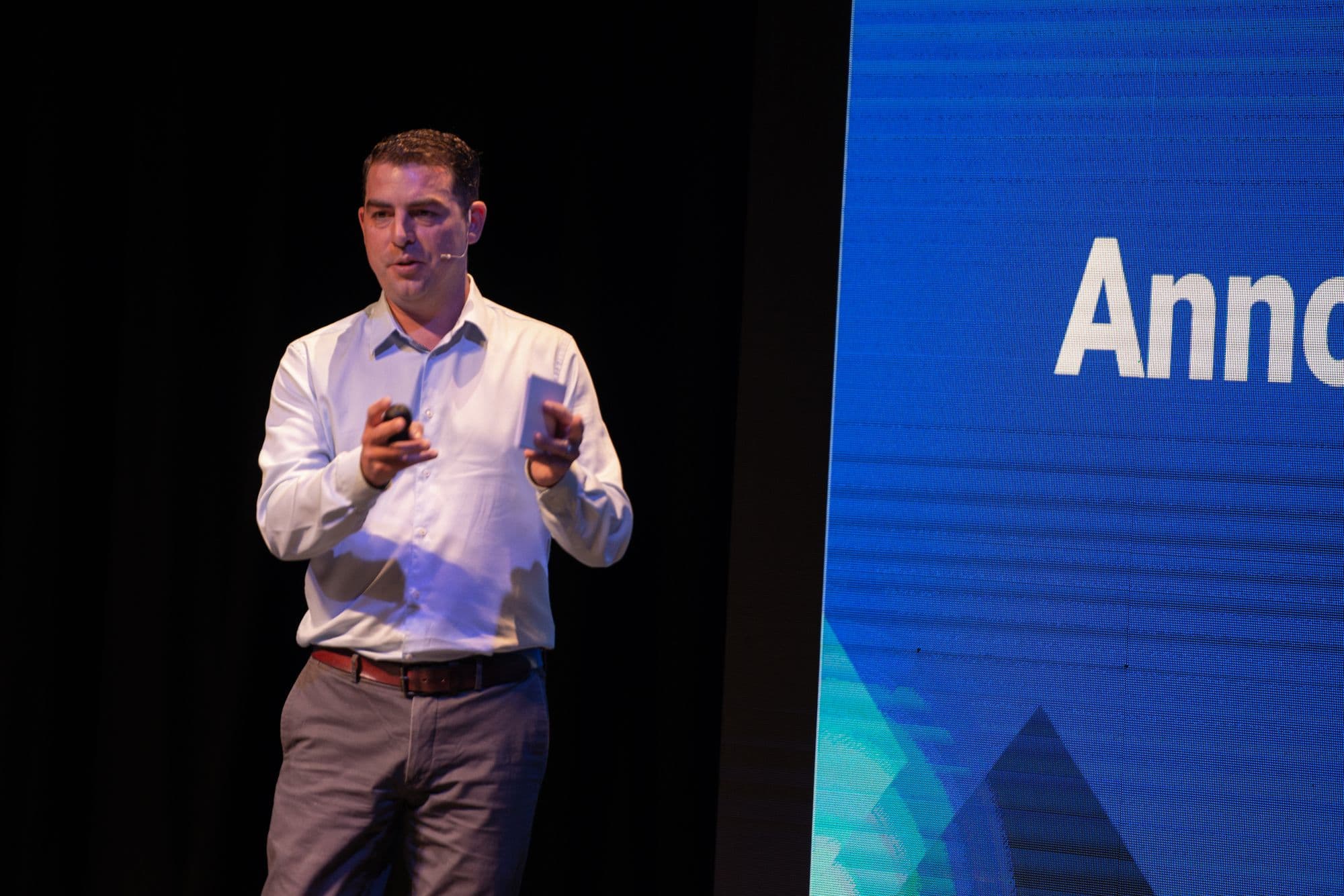 Adam Day presenting on stage at eXp Conference 2024